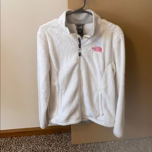 White fuzzy north face jacket